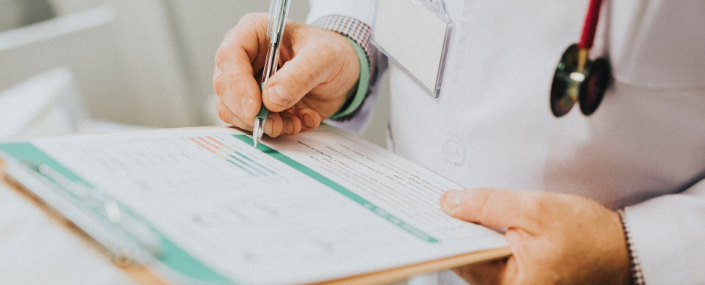 a doctor holding medical reports